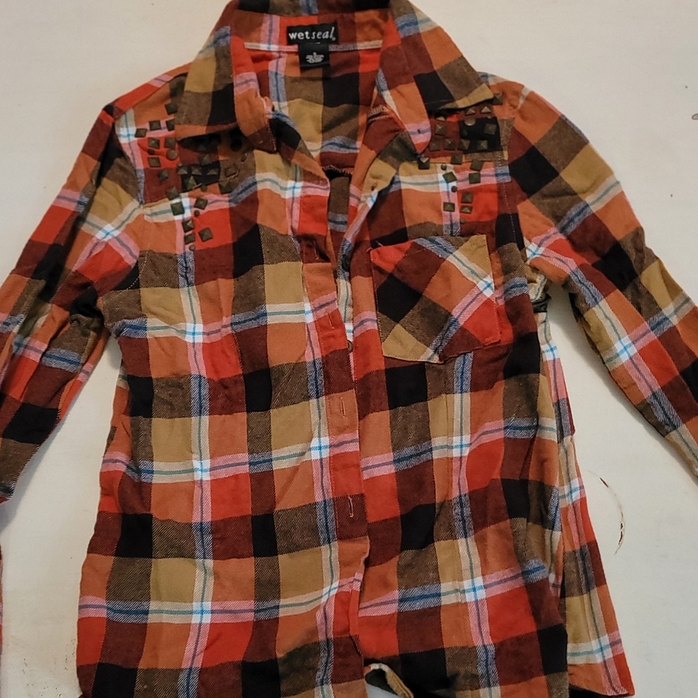 Wet Seal size Small. Plaid orange and brown long sleeve button-up shirt.